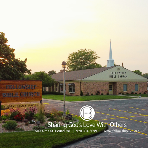 Picture of Fellowship Bible Church building and garden within parking lot