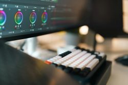 A close up of a computer monitor with a keyboard