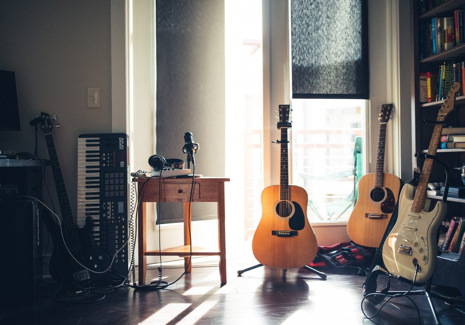 several guitars beside of side table
